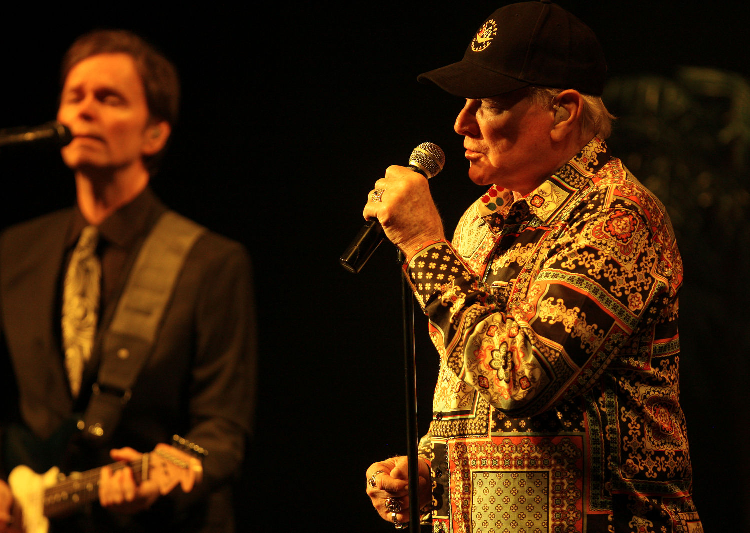 Original band member Mike Love (right) and The Beach Boys perform at the Mississippi Moon Bar inside Diamond Jo Casino on Saturday.    PHOTO CREDIT: Nicki Kohl