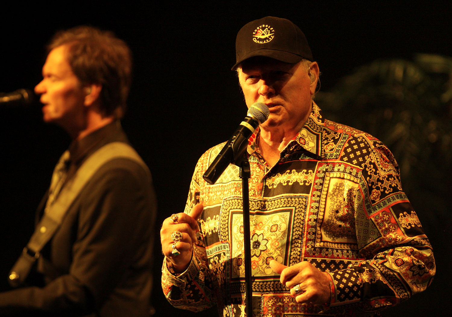 Original band member Mike Love (right) and The Beach Boys perform at the Mississippi Moon Bar inside Diamond Jo Casino on Saturday.    PHOTO CREDIT: Nicki Kohl