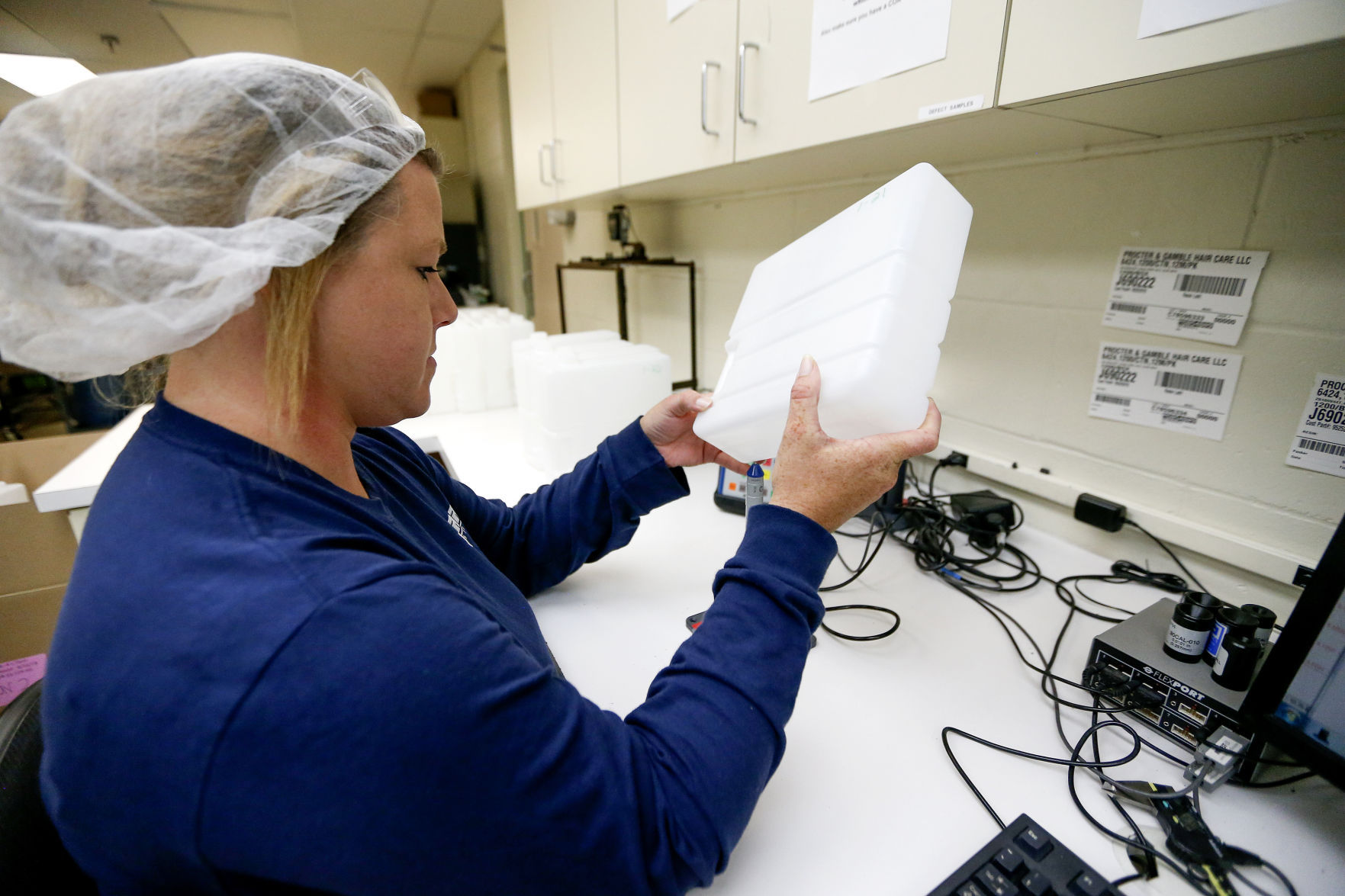 Katie Heinold measures the thickness consistency. PHOTO CREDIT: DAVE KETTERING