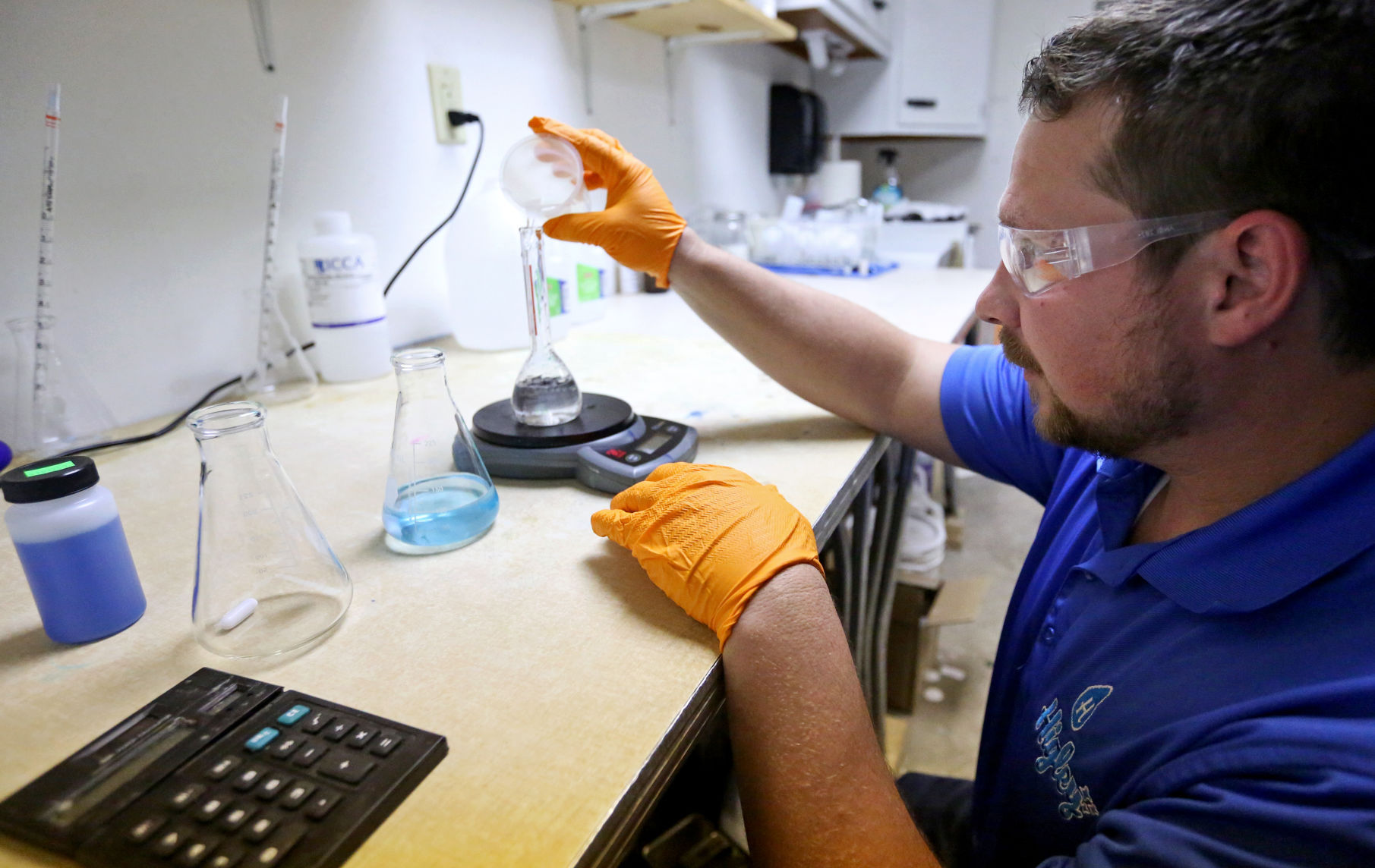 Higley Industries co-owner Lance Hummel runs a test on a sample. PHOTO CREDIT: JESSICA REILLY
