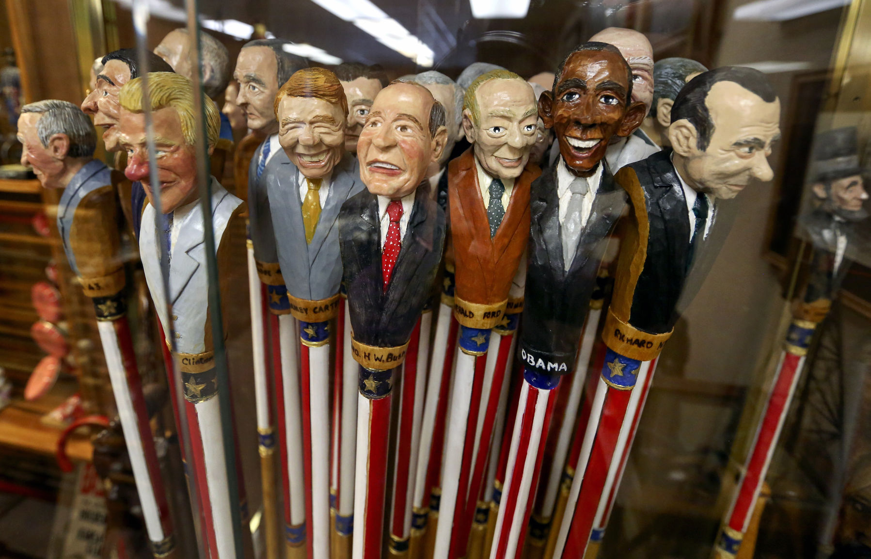 Walking sticks with the likeness of United States presidents.    PHOTO CREDIT: NICKI KOHL