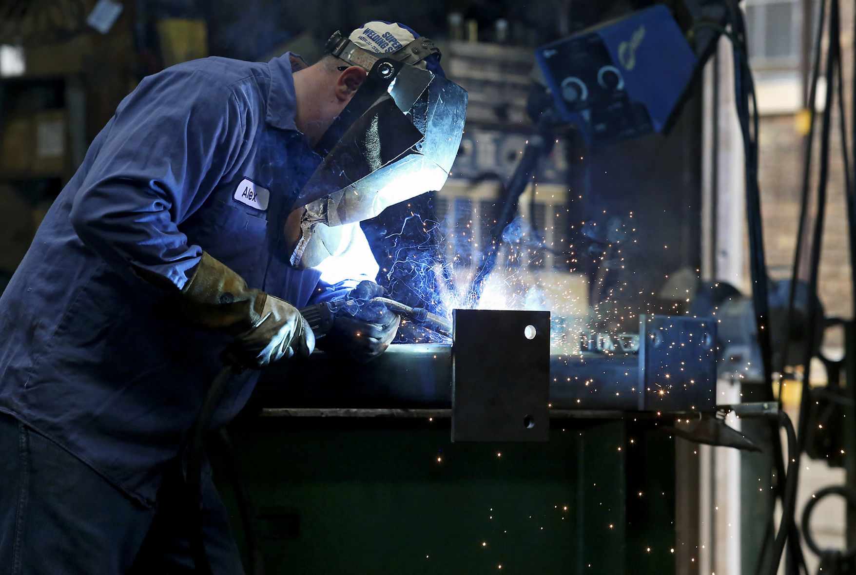 Alex Mihalakis welds steel framing at E.J. Voggenthaler Co. in Dubuque on Wednesday, June 27, 2018.    PHOTO CREDIT: NICKI KOHL