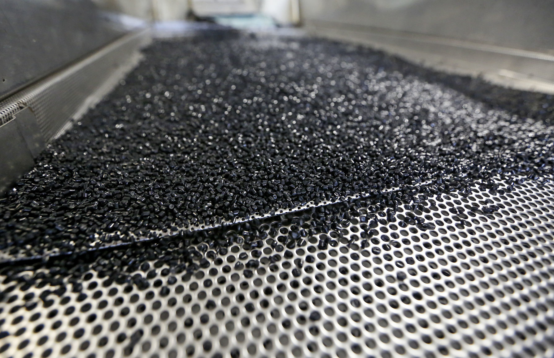 Finished plastic pellets are sorted in a classifier.    PHOTO CREDIT: NICKI KOHL