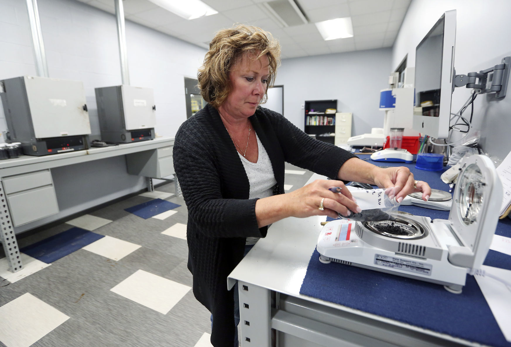 Connie Nebel tests the moisture of raw material at JEDA Polymers in Dyersville, Iowa, on Monday, July 30, 2018.    PHOTO CREDIT: NICKI KOHL