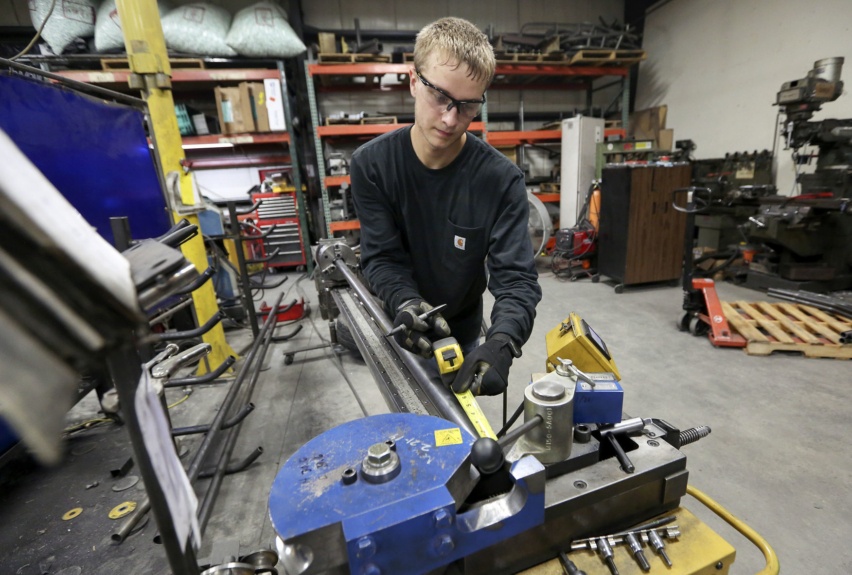 Brett Belscamper prepares a machine to bend tubing at 4x Innovations in Platteville, Wis., on Monday, Aug. 27, 2018.    PHOTO CREDIT: NICKI KOHL
