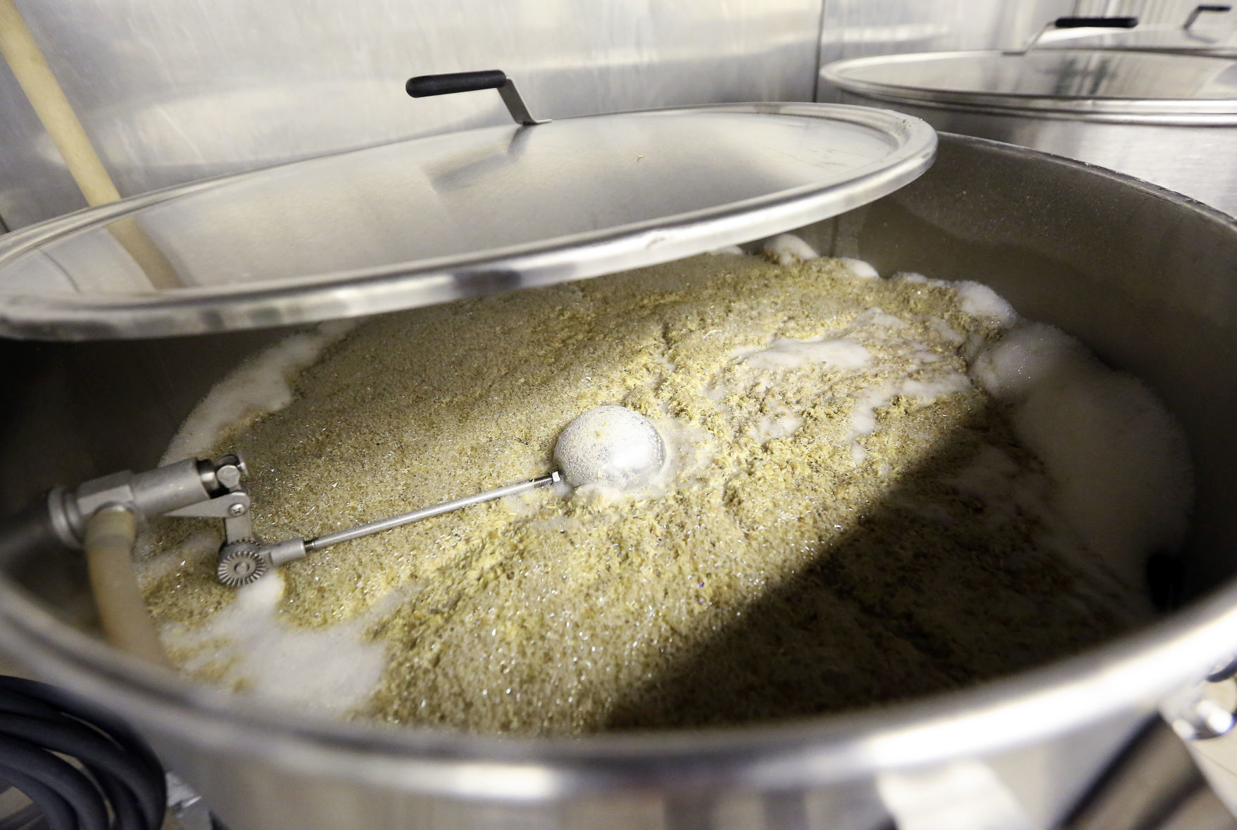 Grains are brought up to temperature as part of the brewing process at River Ridge Brewing in Bellevue, Iowa.    PHOTO CREDIT: NICKI KOHL