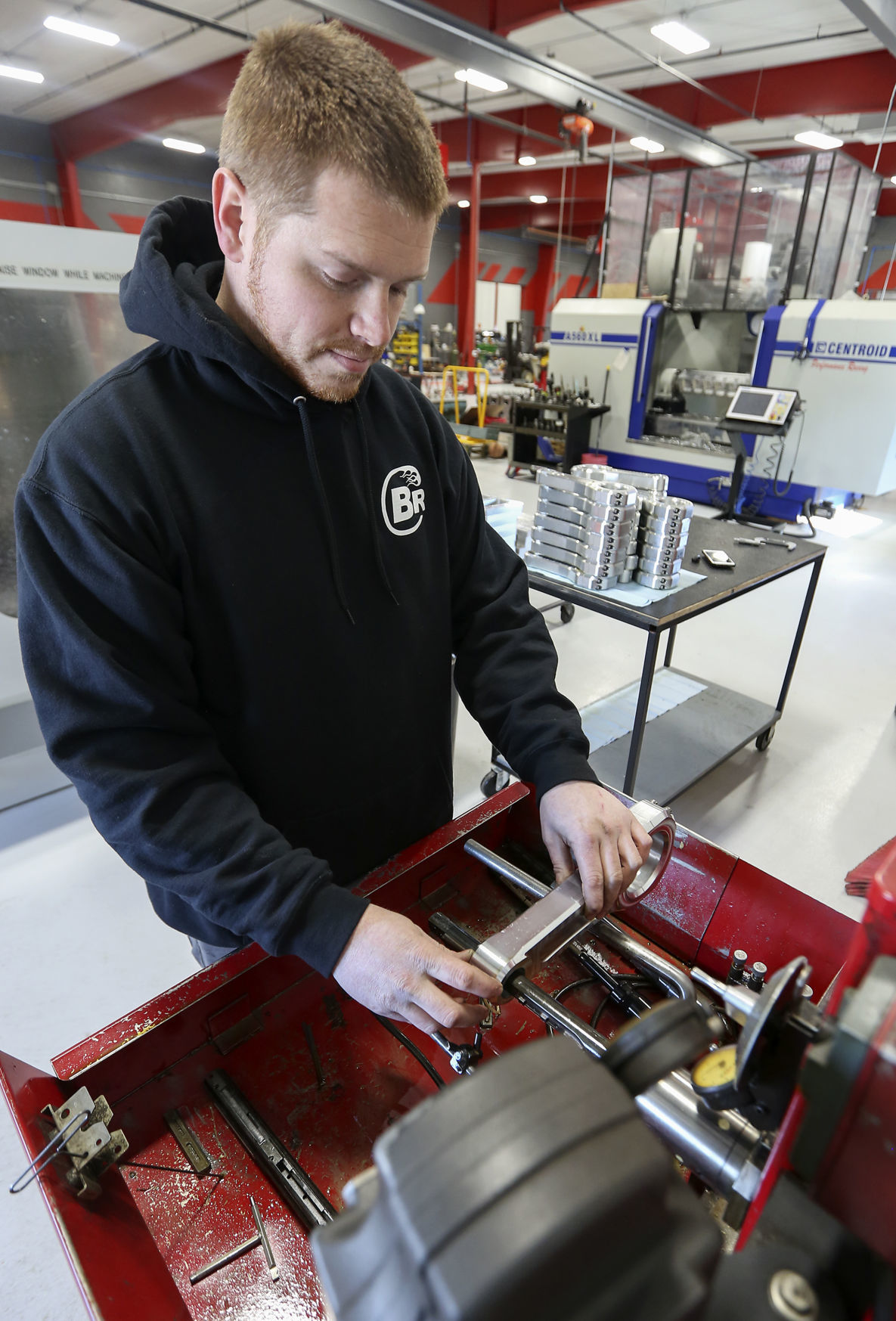 Brandon Block uses a pin hone machine for a connecting rod. The business fabricates all parts for its products.    PHOTO CREDIT: NICKI KOHL