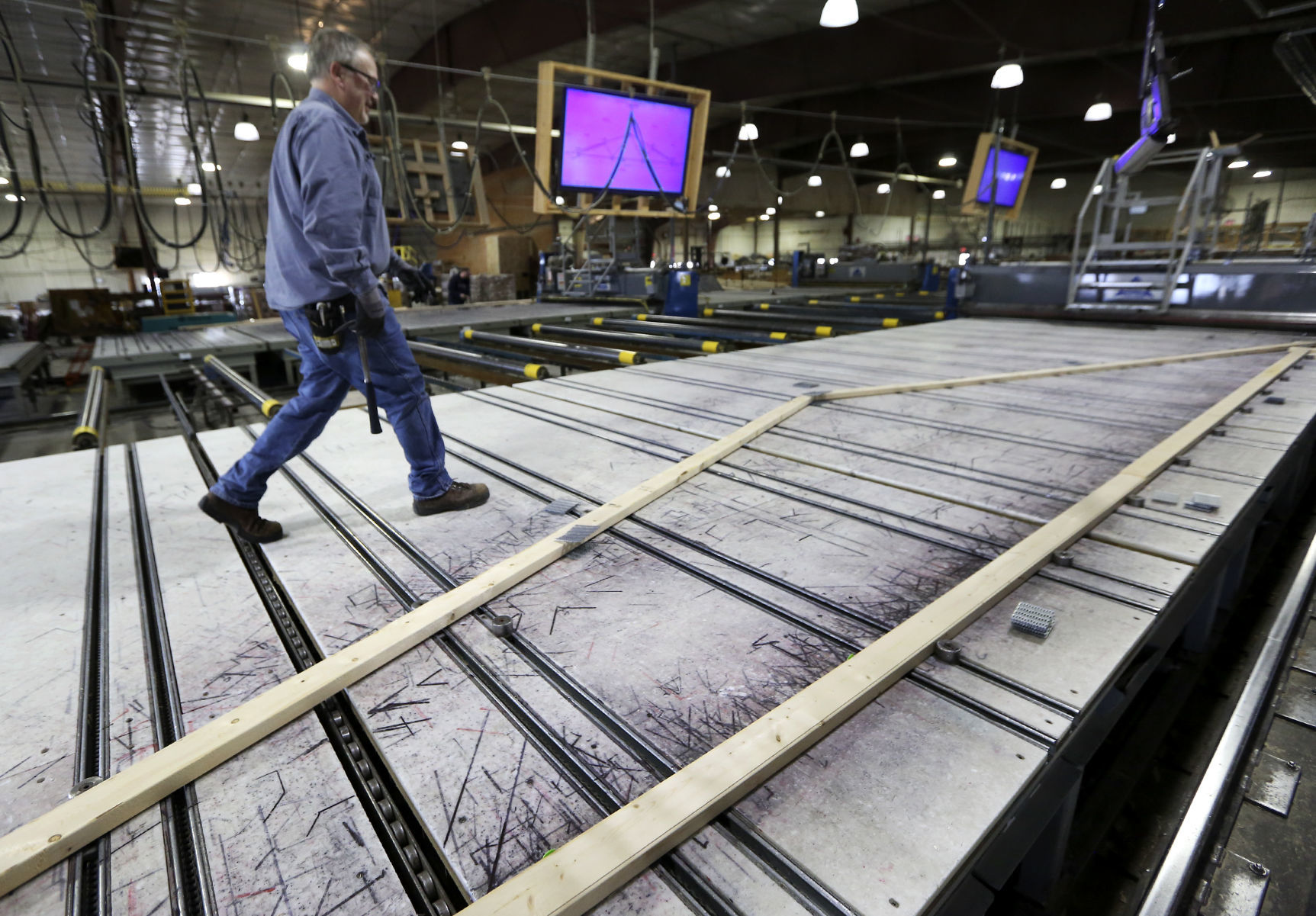 Randy Knapp works to assemble a wood truss at Cascade Manufacturing in Cascade, Iowa, on Thursday, Feb. 19, 2019.    PHOTO CREDIT: NICKI KOHL