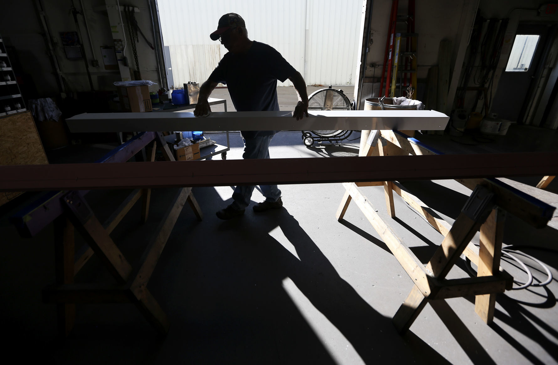 Bill Weitz works at Weitz Sign Company in Dubuque.    PHOTO CREDIT: NICKI KOHL
