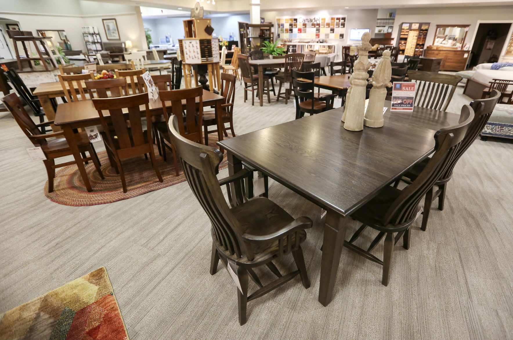 Dining display at FloorShow Furniture & Flooring in Dubuque on Friday, Oct. 4, 2019. FloorShow will have a branding change on Monday, when the company will officially become known as Home + Floor Show. PHOTO CREDIT: NICKI KOHL
