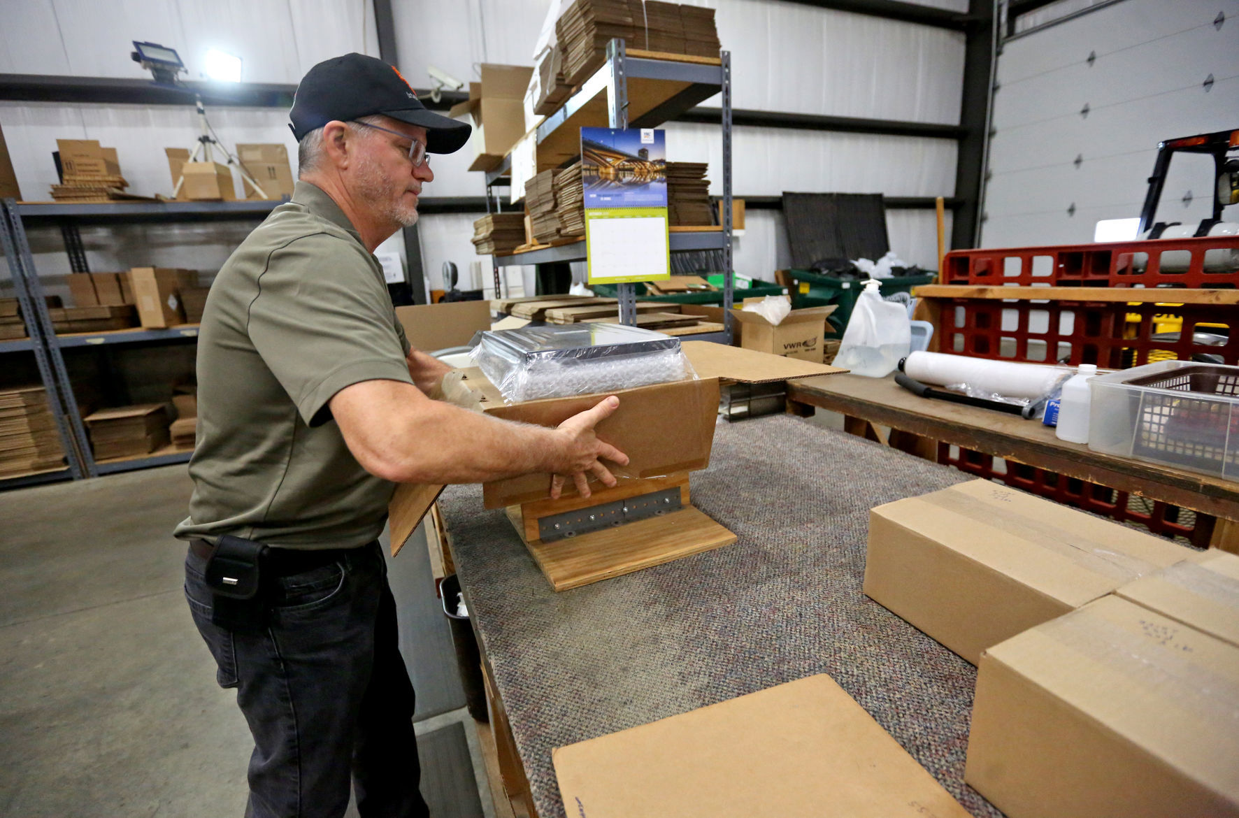 Dan Ehlinger packages orders at IBI Scientific in Dubuque on Friday, Oct. 11, 2019. PHOTO CREDIT: JESSICA REILLY