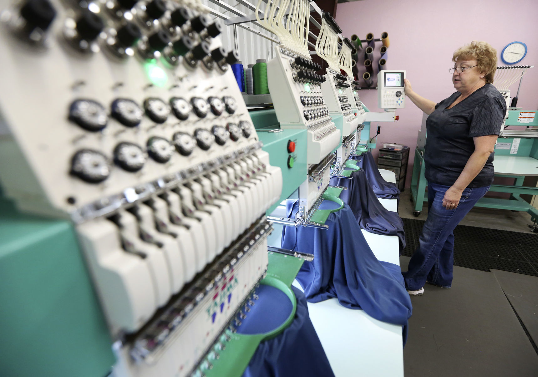 Co-owner Ginnie Gushulak operates an embroidery machine at Buncombe in Hazel Green, Wis. She and her husband, Mike, opened it in 1997 and it has since expanded to a larger facility. It began as a side project but grew into a full-time job.    PHOTO CREDIT: NICKI KOHL