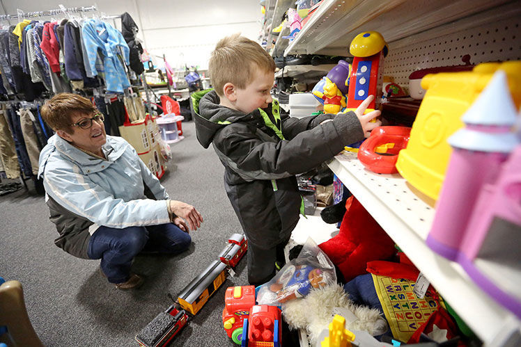 Kathy Hamel and her grandson, Logan Hildebrand, 3, both of Dubuque, look at toys at Stuff Etc. in Dubuque on Wednesday, Dec. 11, 2019. PHOTO CREDIT: JESSICA REILLY