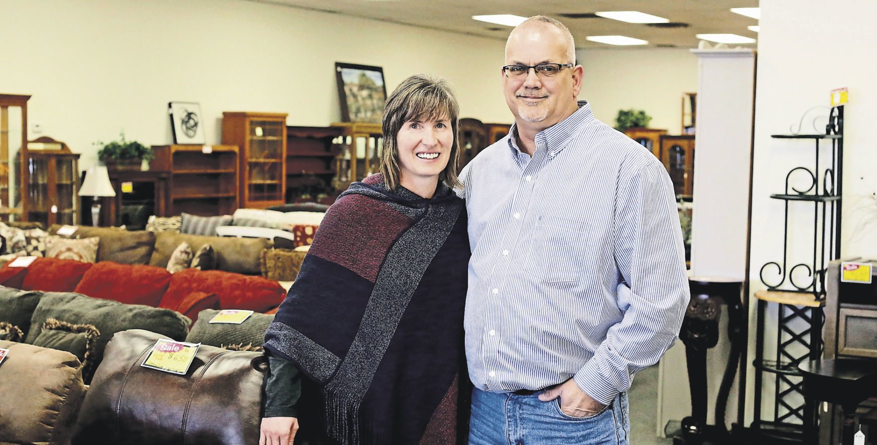 Lois Thurston (left) and Gary Higgins operate Affordable Furniture and Treasurers in Dubuque. It offers new and slightly used items to decorate a home. PHOTO CREDIT: EILEEN MESLAR