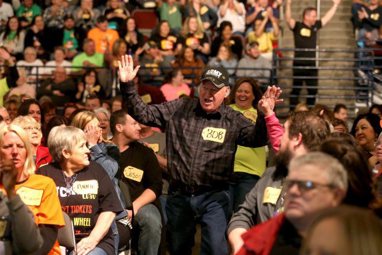 Bob Hocken cheers as he walks up to the stage Tuesday during the “The Price is Right Live!” at Five Flags Center in Dubuque. PHOTO CREDIT: EILEEN MESLAR