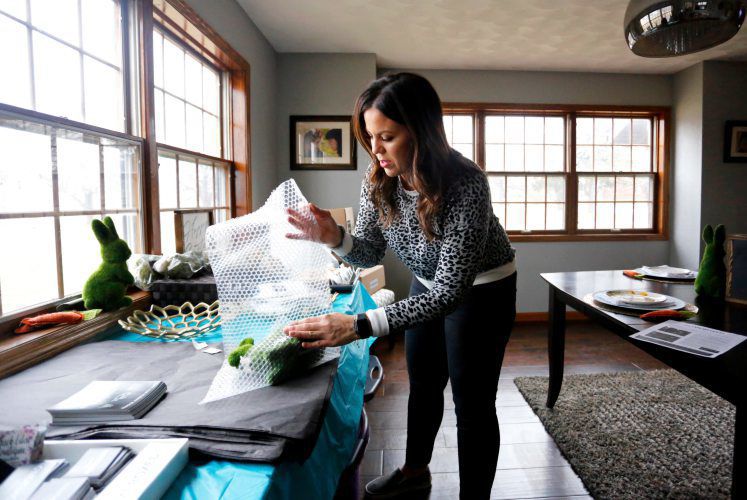 Dee Crist packs up home decor items for her business Homeboxed at her home in Cuba City, Wis., on Sunday, Mar. 15, 2020. PHOTO CREDIT: EILEEN MESLAR