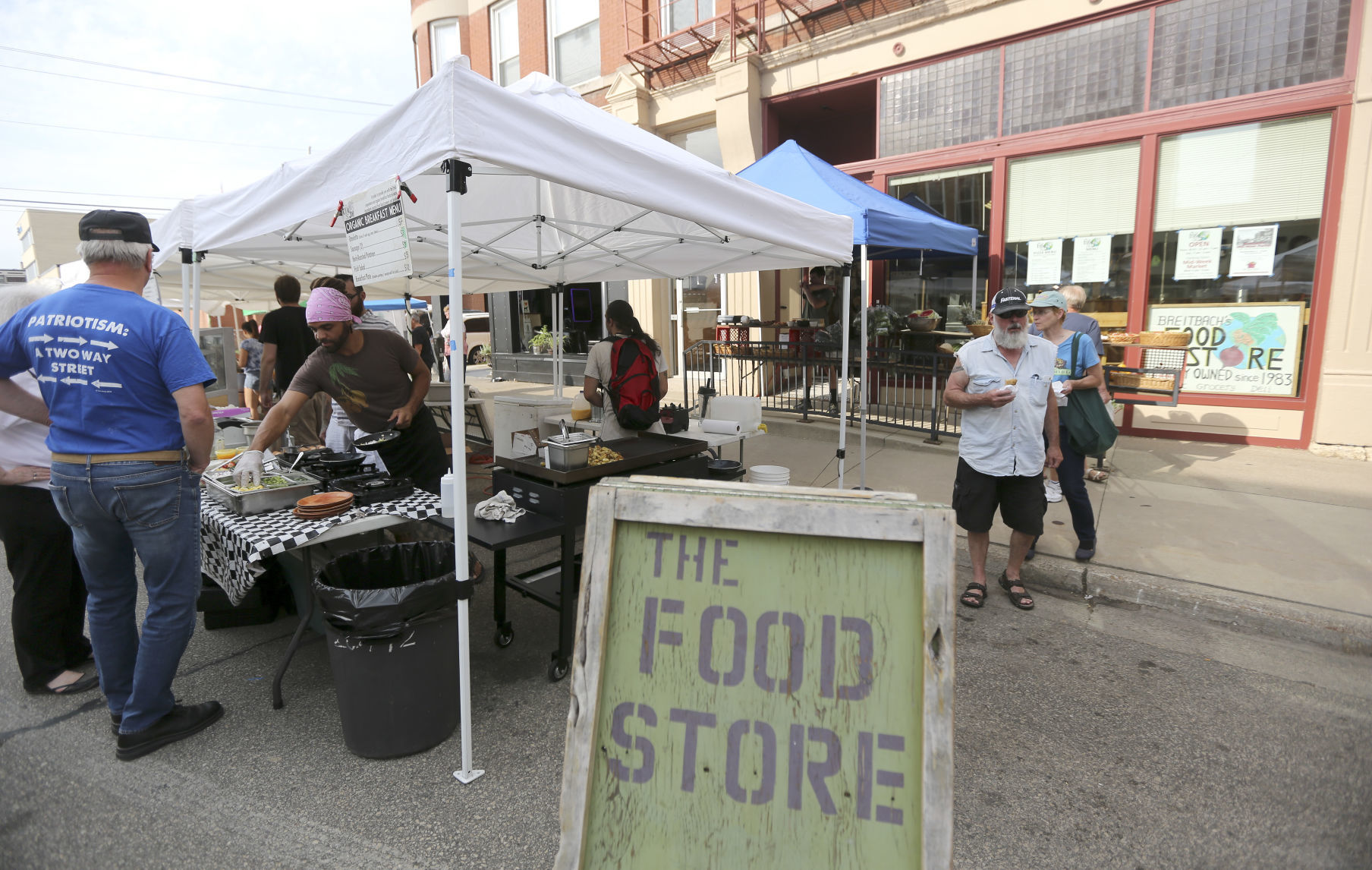 Breitbach’s Food Store serves up breakfast last summer during the farmers market in downtown Dubuque. Dubuque’s farmers market will return this weekend with restrictions in place.    PHOTO CREDIT: Dave Kettering, Telegraph Herald