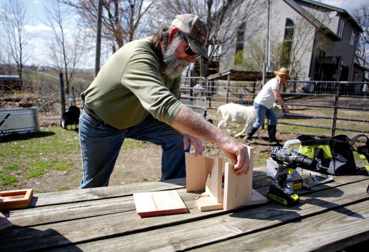 Mark Harting, of H&H Ranch, builds a birdhouse on his farm in Zwingle, Iowa. He and his wife, Leslie Hagar, create products sold at farmers markets and on the internet.    PHOTO CREDIT: EILEEN MESLAR