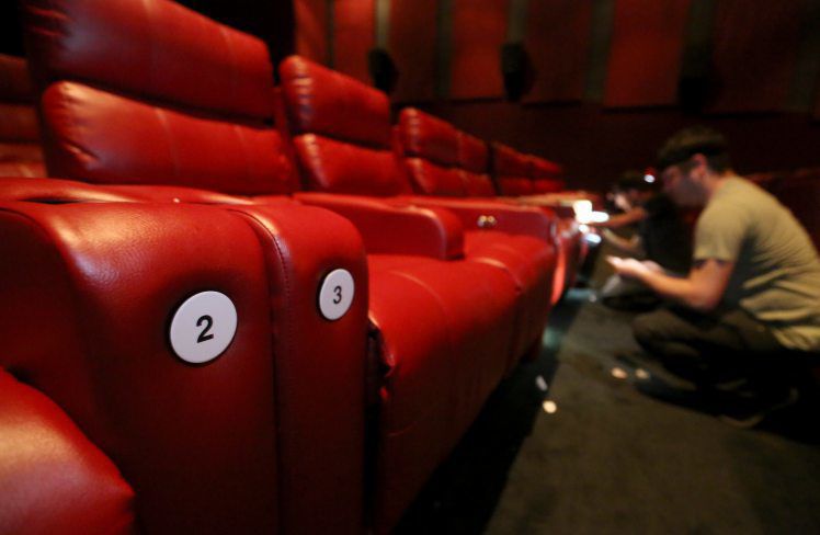 Numbers are displayed on seats at Phoenix Theatres in Dubuque on Thursday, June 11, 2020. PHOTO CREDIT: JESSICA REILLY
