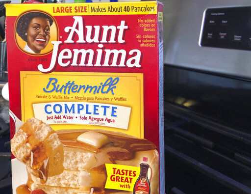 A box of Aunt Jemima pancake mix sits on a stovetop Wednesday, June 17, 2020, in Harrison, N.Y. Pepsico is changing the name and marketing image of its Aunt Jemima pancake mix and syrup, according to media reports. A spokeswoman for Pepsico-owned Quaker Oats Company told AdWeek that it recognized Aunt Jemima’s origins are based on a racial stereotype and that the 131-year-old name and image would be replaced on products and advertising by the fourth quarter of 2020. Quaker did not say what the name would be changed to. (AP Photo/Courtney Dittmar) PHOTO CREDIT: Courtney Dittmar
