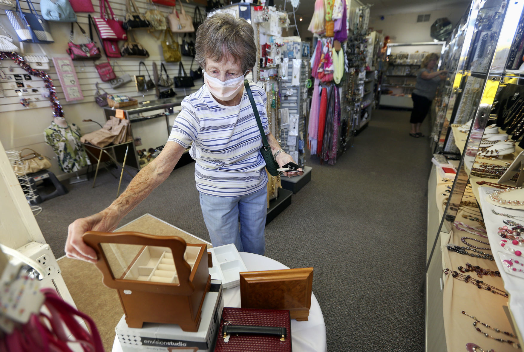 Pat Manders, of Dubuque, browses jewelry boxes at The Jewelry Box in Dubuque on Thursday. PHOTO CREDIT: NICKI KOHL