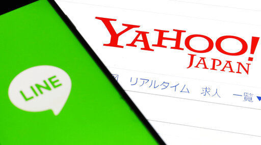 Online services Yahoo Japan and Line Corp. said today the fallout from the coronavirus pandemic is causing delays that will push back their merger to later than the scheduled October date.  PHOTO CREDIT: Shinji Kita