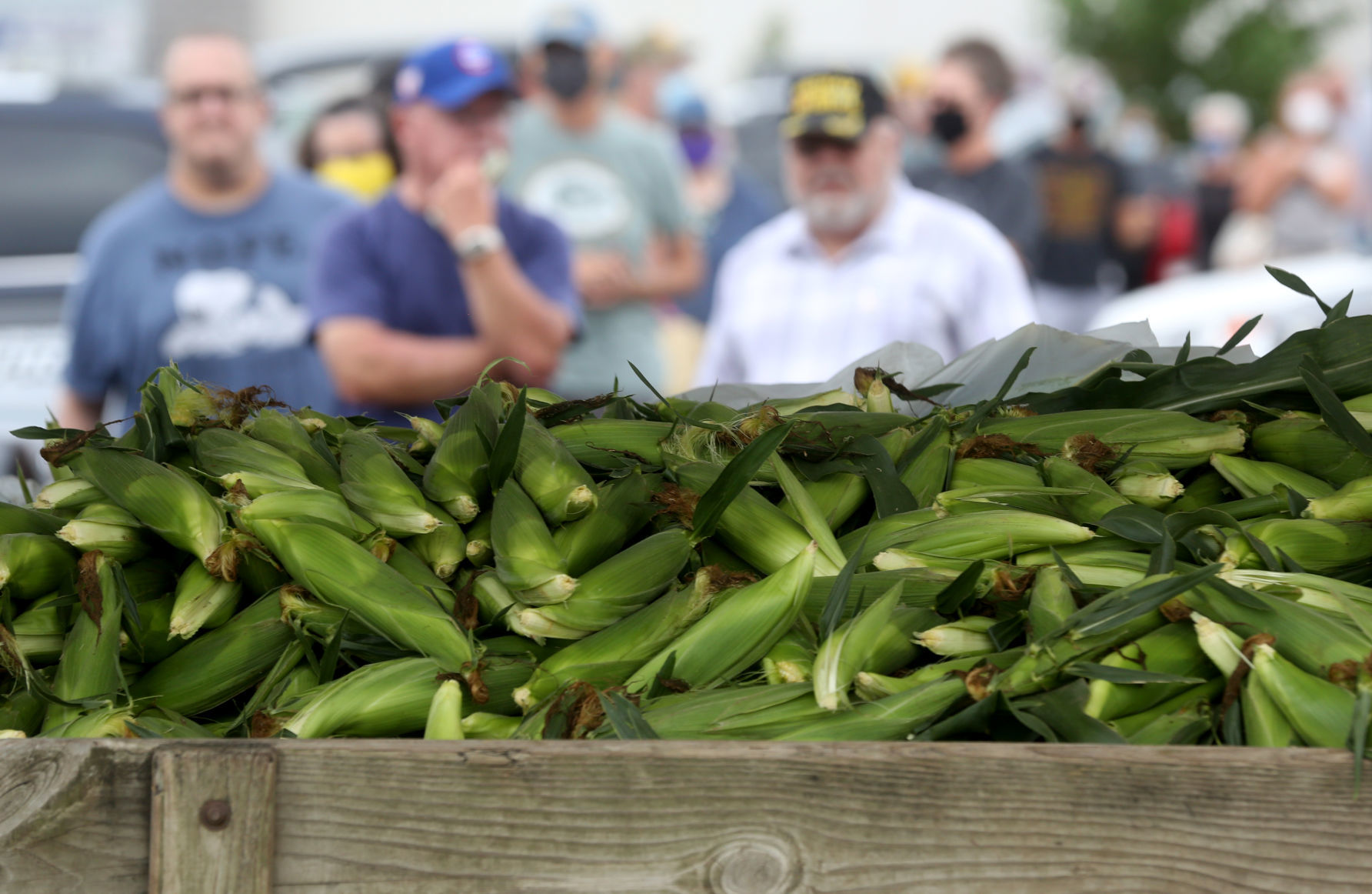 People wait in line for Fincel’s Sweet Corn at Blain’s Farm & Fleet on Saturday. PHOTO CREDIT: JESSICA REILLY