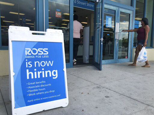 FILE - In this July 8, 2020, file photo, a "Now Hiring" sign sits outside a Ross Dress for Less store, in North Miami Beach, Fla. Unemployment remains painfully high in the U.S. even as economic activity is slowly picking up. That reality will be on display Thursday, July 16, 2020, when the U.S. government releases data on the number of laid off workers seeking unemployment benefits the week prior and retail sales in June. (AP Photo/Wilfredo Lee, File) PHOTO CREDIT: Wilfredo Lee
