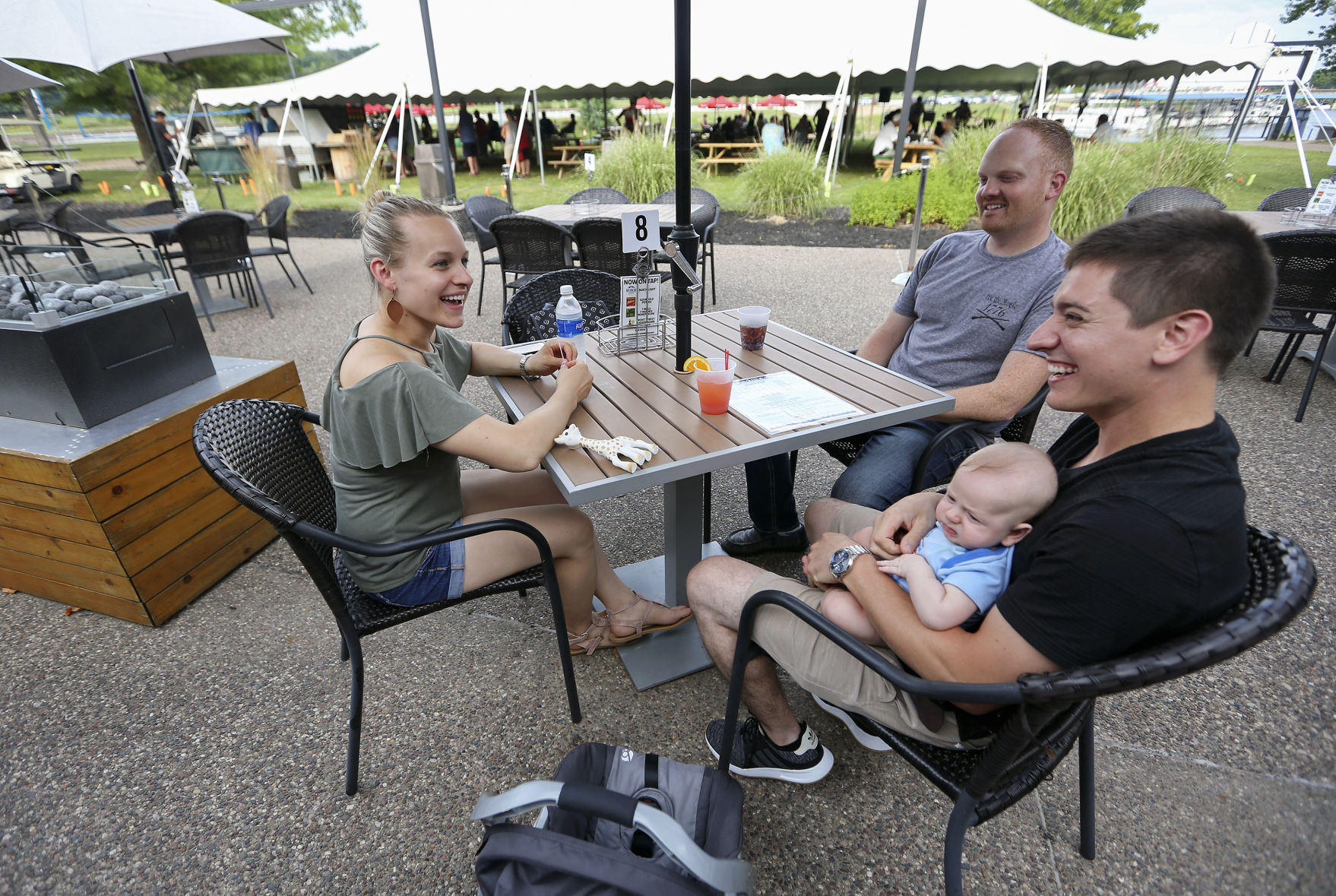 Ashley Gerlach (from left), Anthony Johnson, Carter Davis and Steve Davis dine outside at Frentress Lake Bar & Grill in East Dubuque, Ill., on Saturday. PHOTO CREDIT: NICKI KOHL