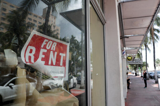 FILE - In this July 13, 2020 file photo, a For Rent sign hangs on a closed shop during the coronavirus pandemic in Miami Beach, Fla. Having endured what was surely a record-shattering slump last quarter, the U.S. economy faces a dim outlook as a resurgent coronavirus intensifies doubts about the likelihood of any sustained recovery the rest of the year. (AP Photo/Lynne Sladky) PHOTO CREDIT: Lynne Sladky