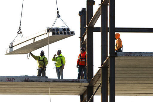 FILE - In this Dec. 3, 2019, file photo, workers erect a building under construction in Philadelphia. U.S. construction spending fell again in June 2020, the fourth straight decline as the coronavirus outbreak continues to wreak havoc on the economy. (AP Photo/Matt Rourke, File) PHOTO CREDIT: Matt Rourke