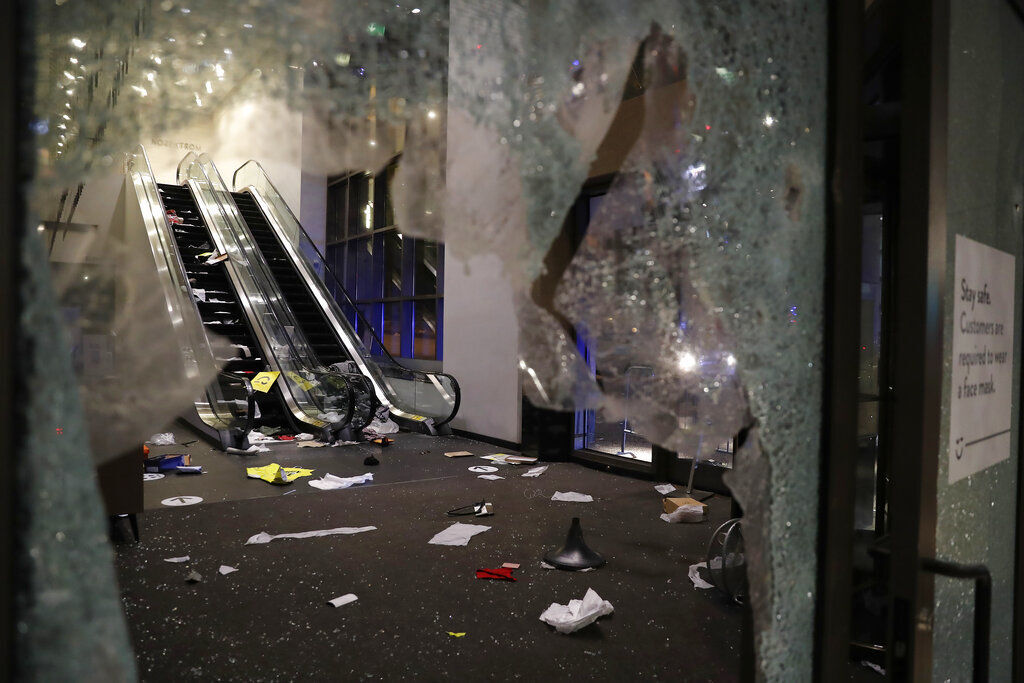 Glass is shattered in the Nordstrom store after a riot occurred in the Gold Coast area of Chicago early this morning. Hundreds of people smashed windows, stole from stores and clashed with police in Chicago