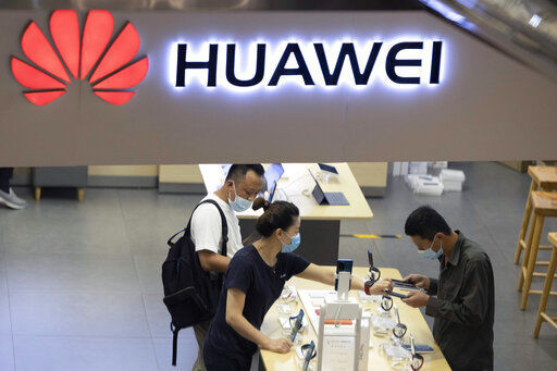 China accused Washington of damaging global trade with sanctions that threaten to cripple tech giant Huawei and said today it will protect Chinese companies but gave no indication of possible retaliation. PHOTO CREDIT: Ng Han Guan