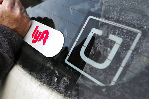 Ride-hailing giants Uber and Lyft today are saying they will shut down their California operations if a new law goes into effect overnight which would force both companies to classify their drivers as employees.  PHOTO CREDIT: Gene J. Puskar