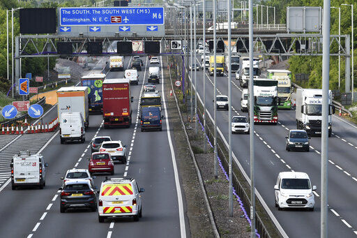 FILE - In this file photo dated Monday, May 18, 2020, traffic moves along the M6 motorway near Birmingham, England. Trade associations representing British freight haulers and storage companies are asking for urgent talks with government leaders to allay concerns over preparations for Brexit, that may threaten supplies of critical goods caused by border controls and computer systems. (AP Photo/Rui Vieira, FILE) PHOTO CREDIT: Rui Vieira