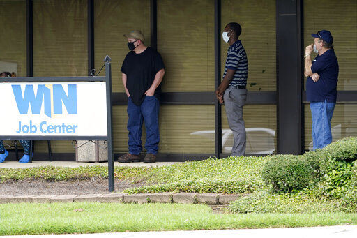 FILE - In this Aug. 31, 2020, file photo, clients line up outside the Mississippi Department of Employment Security WIN Job Center in Pearl, Miss. The government issues the jobs report Friday, Sept. 4, for August at a time of continuing layoffs and high unemployment. (AP Photo/Rogelio V. Solis, File) PHOTO CREDIT: Rogelio V. Solis