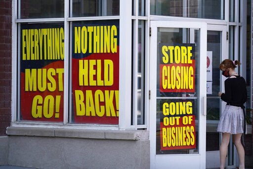 FILE - In this Aug. 30, 2020, file photo, store closing signs are shown on a Stein Mart store in Salt Lake City. The government issues the jobs report Friday, Sept. 4, for August at a time of continuing layoffs and high unemployment. (AP Photo/Rick Bowmer, File) PHOTO CREDIT: Rick Bowmer