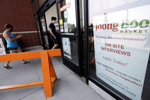 FILE - In this June 18, 2020, file photo, a hiring sign is displayed at a grocery store in Glenview, Ill. The government issues the jobs report Friday, Sept. 4, for August at a time of continuing layoffs and high unemployment. (AP Photo/Nam Y. Huh, File) PHOTO CREDIT: Nam Y. Huh