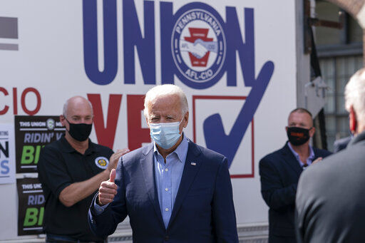 Democratic presidential candidate former Vice President Joe Biden gives the thumbs up as he arrives to pose for photographs with union leaders outside the AFL-CIO headquarters in Harrisburg, Pa., Monday, Sept. 7, 2020. (AP Photo/Carolyn Kaster) PHOTO CREDIT: Carolyn Kaster