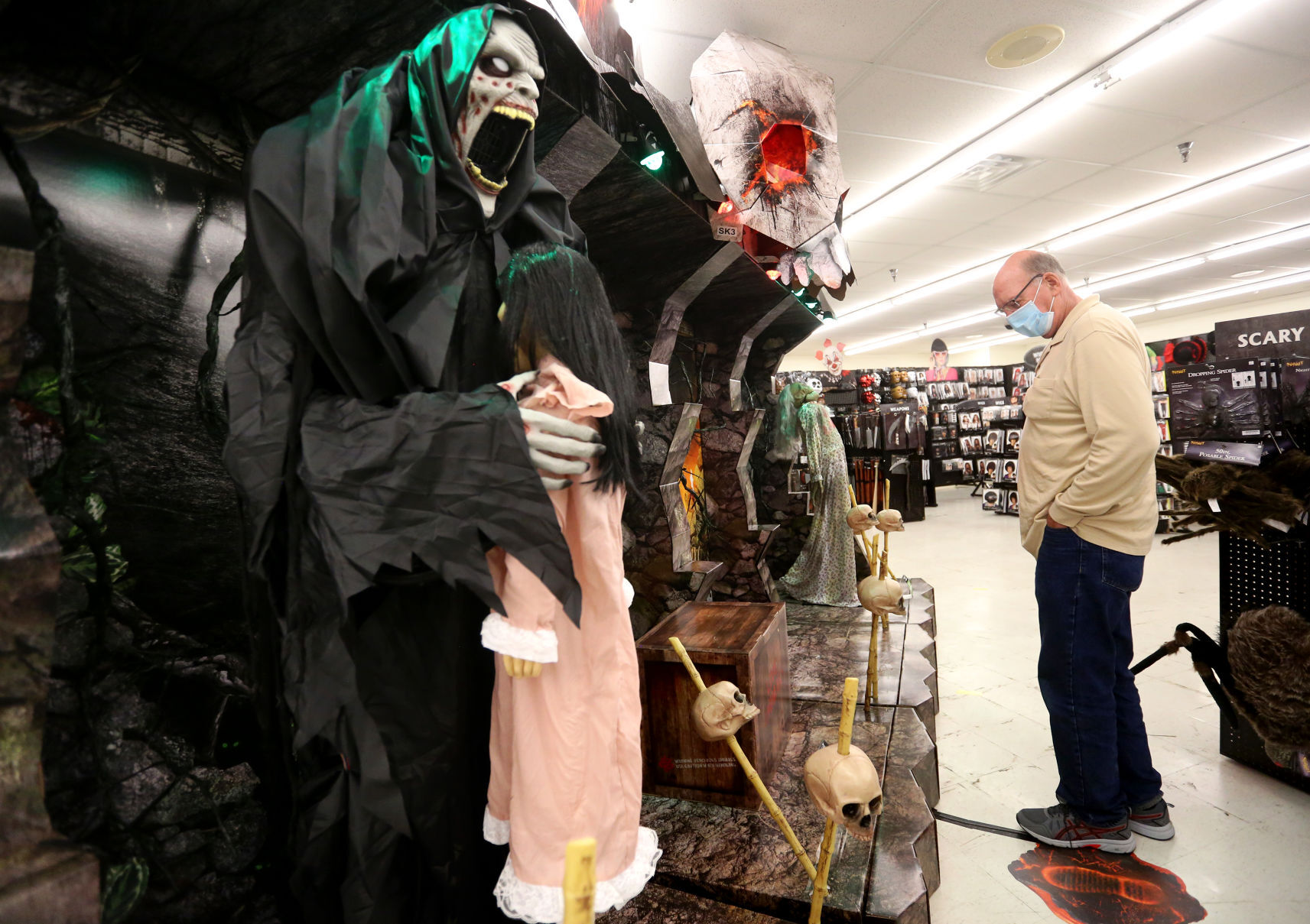 Neil Candee, of Dubuque, looks at a display at Spirit Halloween in Dubuque on Friday, Sept. 11, 2020. PHOTO CREDIT: JESSICA REILLY