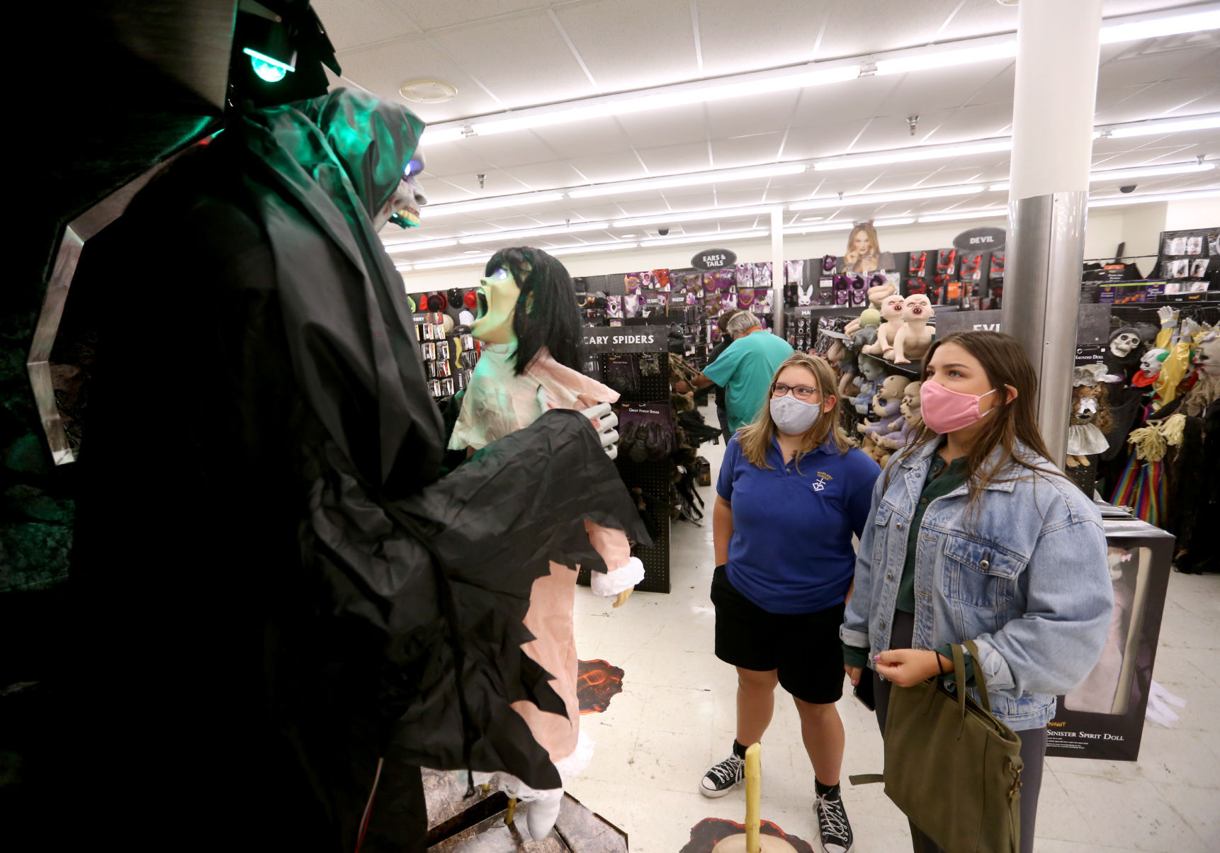 Abbey Gasper (left), 14, and her sister Hannah Gasper, 22, both of Dubuque, look at a display at Spirit Halloween in Dubuque on Friday, Sept. 11, 2020. PHOTO CREDIT: JESSICA REILLY