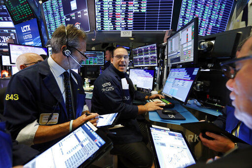 Stocks are opening solidly higher on Wall Street today following a burst of big corporate deals. The S&P 500 was up 1.7%, led by gains technology stocks and companies that rely on consumer spending.  PHOTO CREDIT: Richard Drew