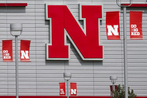 The Nebraska logo and flags incorporating the Big Ten logo are seen outside the Devaney sports center in Lincoln, Neb., Tuesday, Sept. 15, 2020. (AP Photo/Nati Harnik) PHOTO CREDIT: Nati Harnik