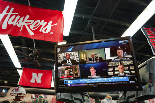 The Husker Hounds sports apparel store in Omaha, Neb., shows on television screens Wednesday, Sept. 16, 2020, a Big Ten virtual news conference to discuss the reopening of the football season. Less than five weeks after pushing football and other fall sports to spring in the name of player safety during the pandemic, the conference changed course Wednesday and said it plans to begin its season the Oct. 23-24 weekend. Each team will have an eight-game schedule. (AP Photo/Nati Harnik) PHOTO CREDIT: Nati Harnik