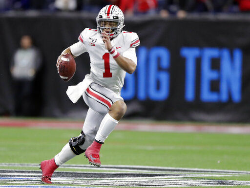 FILE - In this Dec. 7, 2019, file photo, Ohio State quarterback Justin Fields (1) runs with the ball against Wisconsin during the first half of the Big Ten championship NCAA college football game, in Indianapolis. Big Ten is going to give fall football a shot after all. Less than five weeks after pushing football and other fall sports to spring in the name of player safety during the pandemic, the conference changed course Wednesday, Sept. 16, 2020, and said it plans to begin its season the weekend of Oct. 23-24. (AP Photo/Michael Conroy, File) PHOTO CREDIT: Michael Conroy