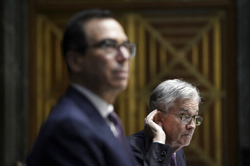 Treasury Secretary Steven Mnuchin (left) and Federal Reserve Board Chairman Jerome Powell. PHOTO CREDIT: Drew Angerer