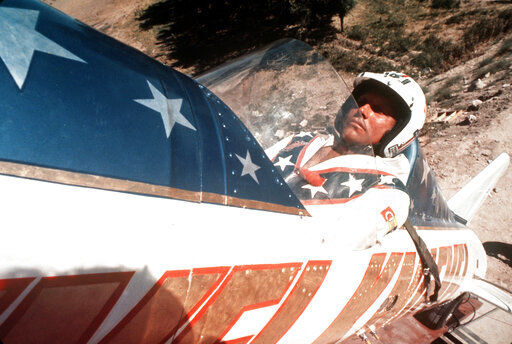 In this Sept. 8, 1974, file photo, Evel Knievel sits in the steam-powered rocket motorcycle that will hopefully take him across Snake River Canyon in Twin Falls, Idaho. Evel Knievel’s son is on a collision course with the Walt Disney Co. and Pixar over a movie daredevil character named Duke Caboom. A federal trademark infringement lawsuit filed Tuesday, Sept. 22, 2020, in Las Vegas accuses the moviemaker of improperly basing the “Toy Story 4” character on Knievel.  PHOTO CREDIT: Anonymous