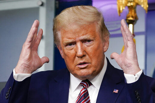 President Donald Trump gestures while speaking during a news conference at the White House. The bombshell revelations that Trump paid just $750 in federal income taxes the year he ran for office and paid no income taxes at all in many others threaten to undercut a pillar of his appeal among blue-collar voters PHOTO CREDIT: Carolyn Kaster