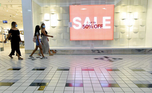 FILE - In this Aug. 11, 2020 file photo, shoppers walk through the Valley Mall in Halfway, Md. U.S. consumer confidence rebounded more quickly in September than most economists had expected, but it remains well below levels that preceded the pandemic. The Conference Board reported Tuesday, Sept. 29 that its consumer confidence index rose to a reading of 101.8, up from 86.3 in August. (Colleen McGrath/The Herald-Mail via AP, File) PHOTO CREDIT: Colleen McGrath