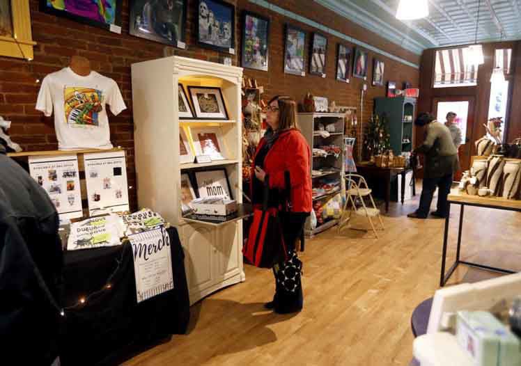 Diane Hein, of Dubuque, walks looks at different products at the Central Avenue Mercantile in Dubuque on Friday, Nov. 1, 2019. PHOTO CREDIT: EILEEN MESLAR